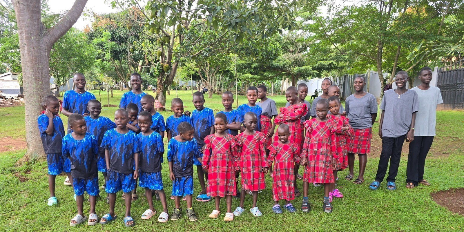 Children of Literacy of Love together outdoors
